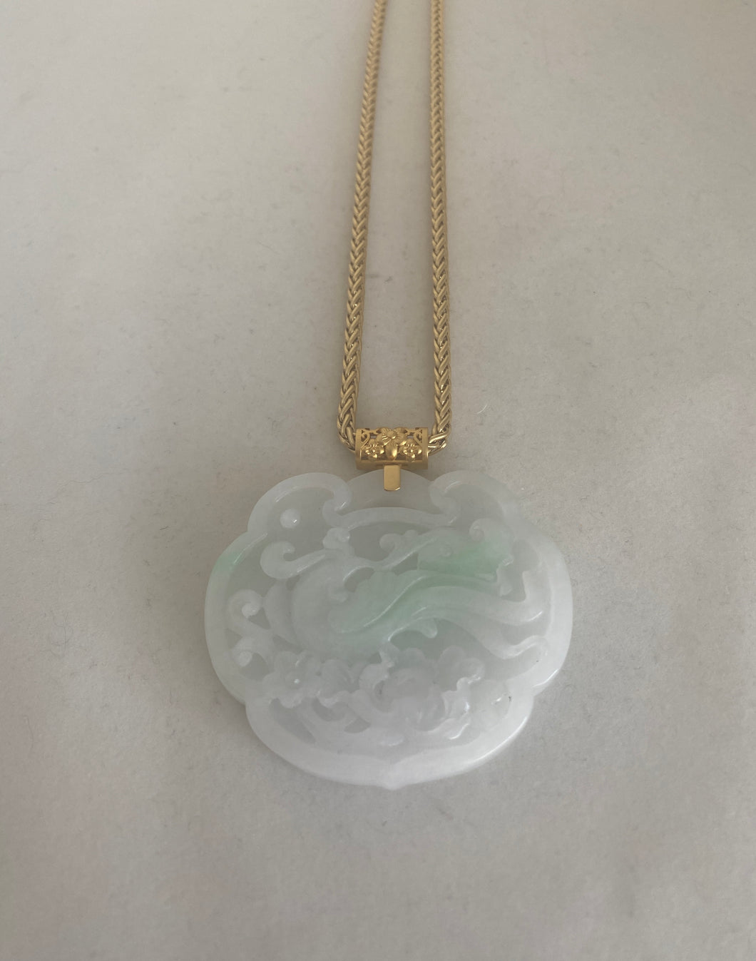 18K SNOW WHITE JADE PENDANT WITH CARVED PHOENIX AND DRAGON