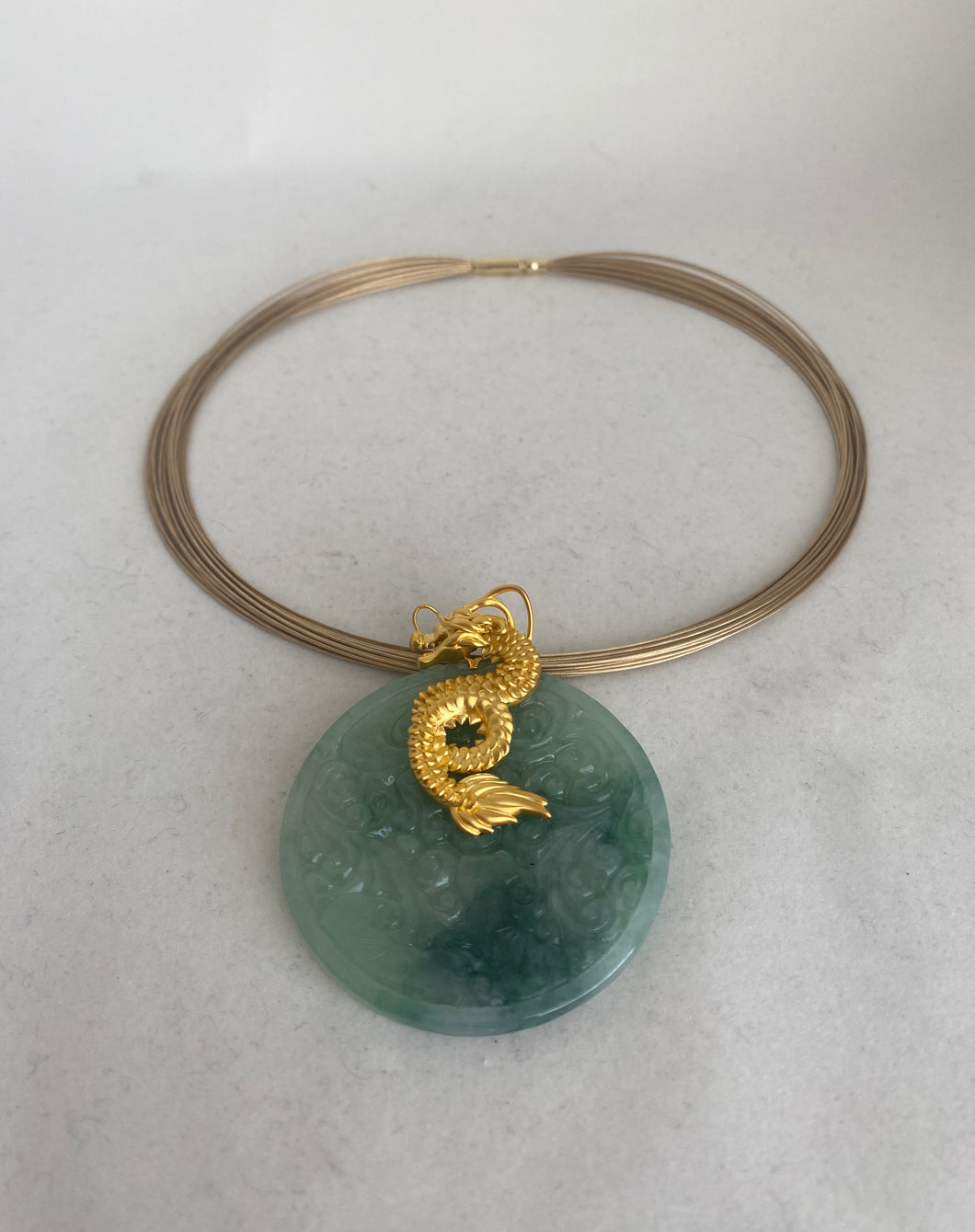 18K TRANSLUCENT DEEP GREEN JADE MEDALLION WITH A GOLD DRAGON