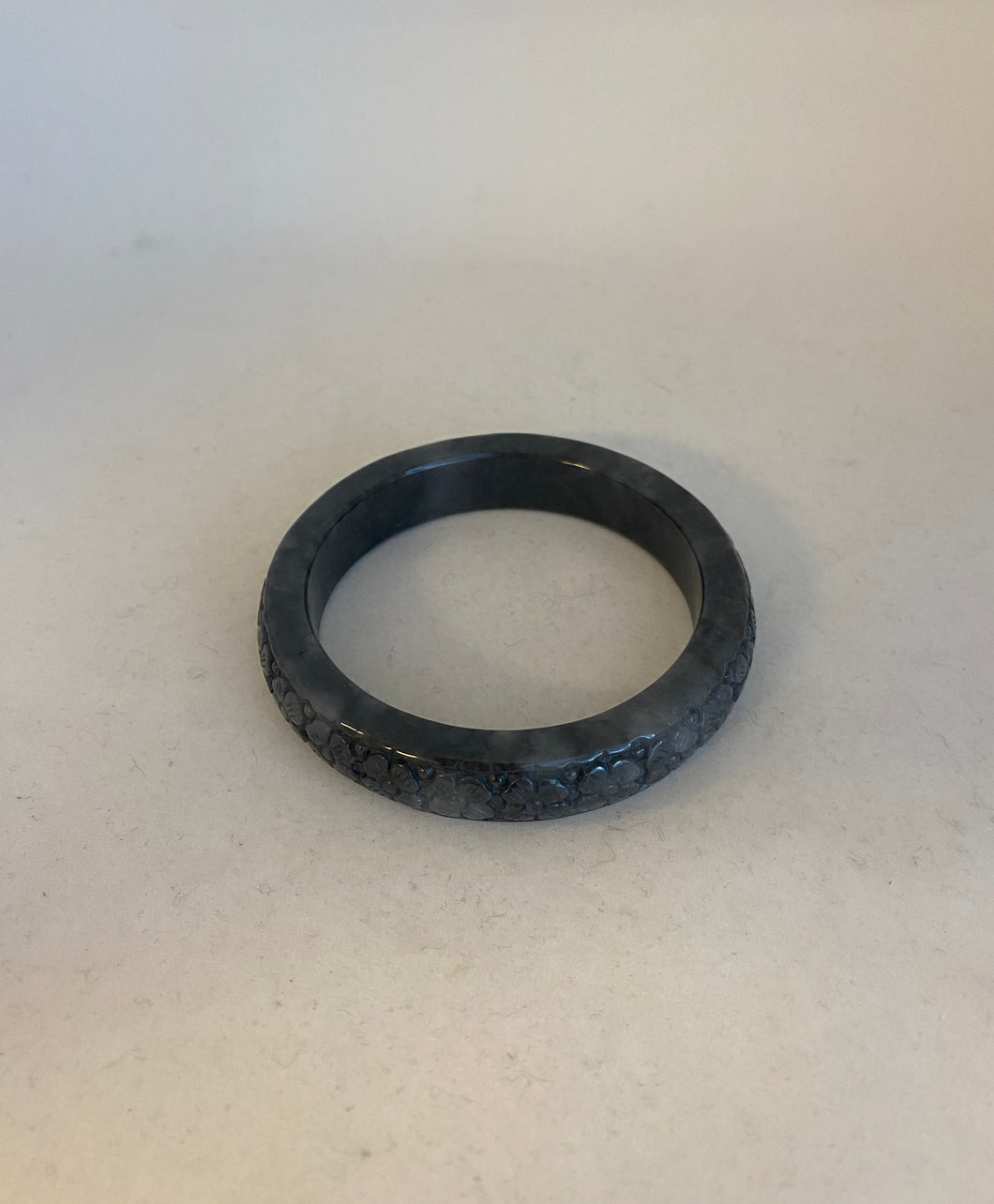 CARVED CHARCOAL GREY JADEITE JADE BANGLE