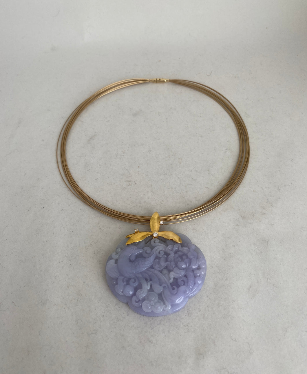 18 KARAT CARVED LAVENDER JADE PENDANT