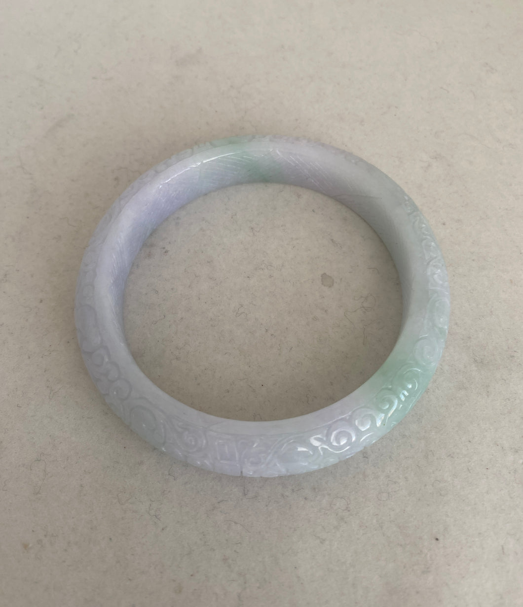 CARVED JADEITE JADE BANGLE WITH ASIAN MOTIFS