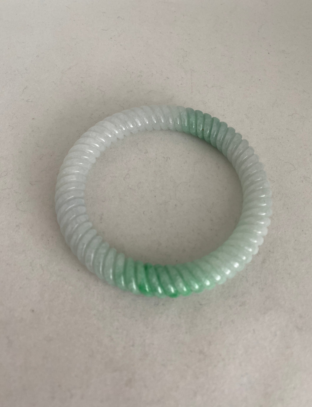 CARVED WHITE WITH BRIGHT GREEN JADE BANGLE