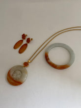 Load image into Gallery viewer, CARVED APRICOT JADE PENDANT WITH MANDARIN GARNET ON TOP
