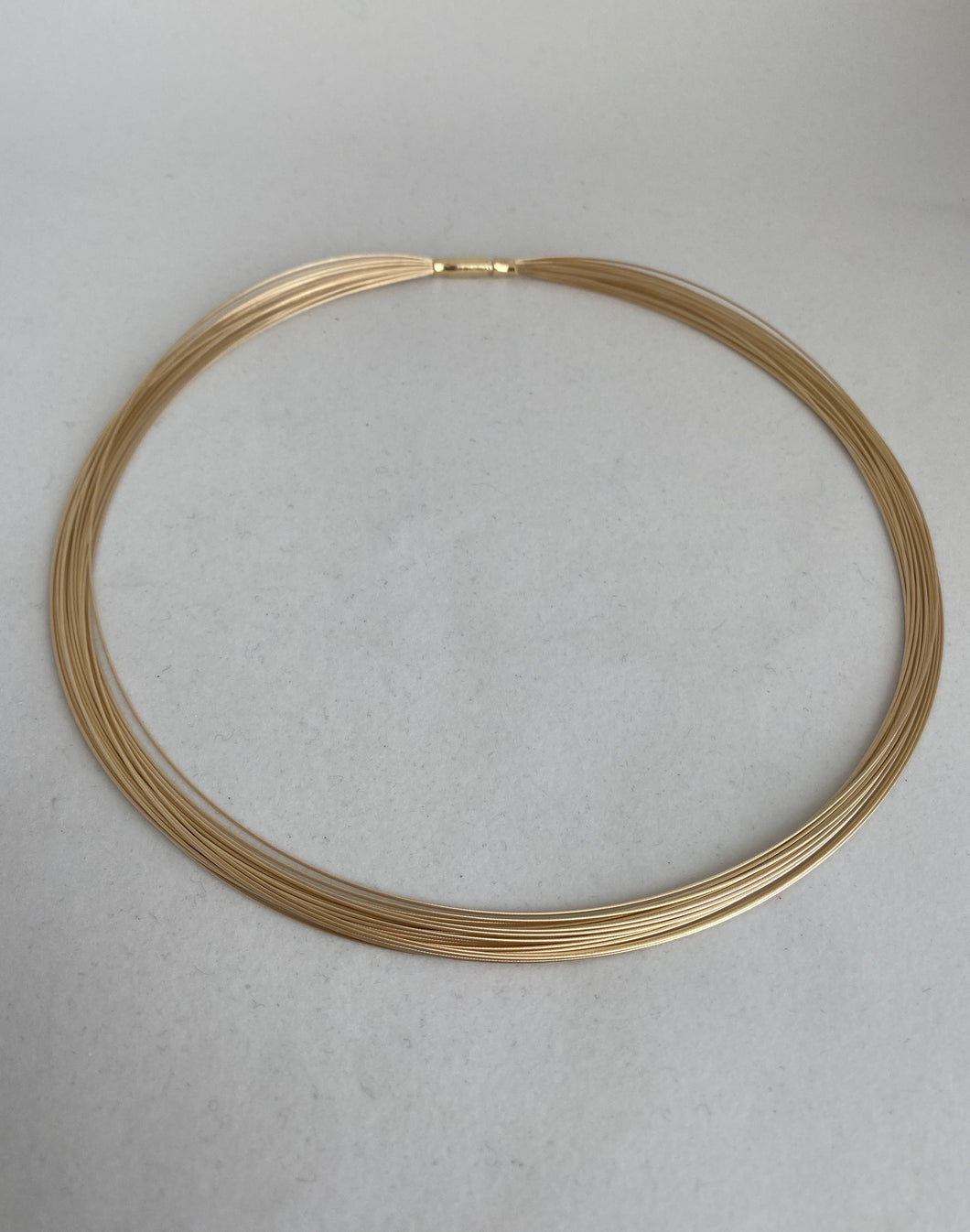 14K 21 STRNDS GOLD NECK WIRE