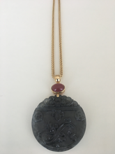 Load image into Gallery viewer, Carved charcoal jade pendant with rubellite in 18k yellow gold.
