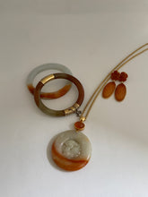 Load image into Gallery viewer, CARVED APRICOT JADE PENDANT WITH MANDARIN GARNET ON TOP
