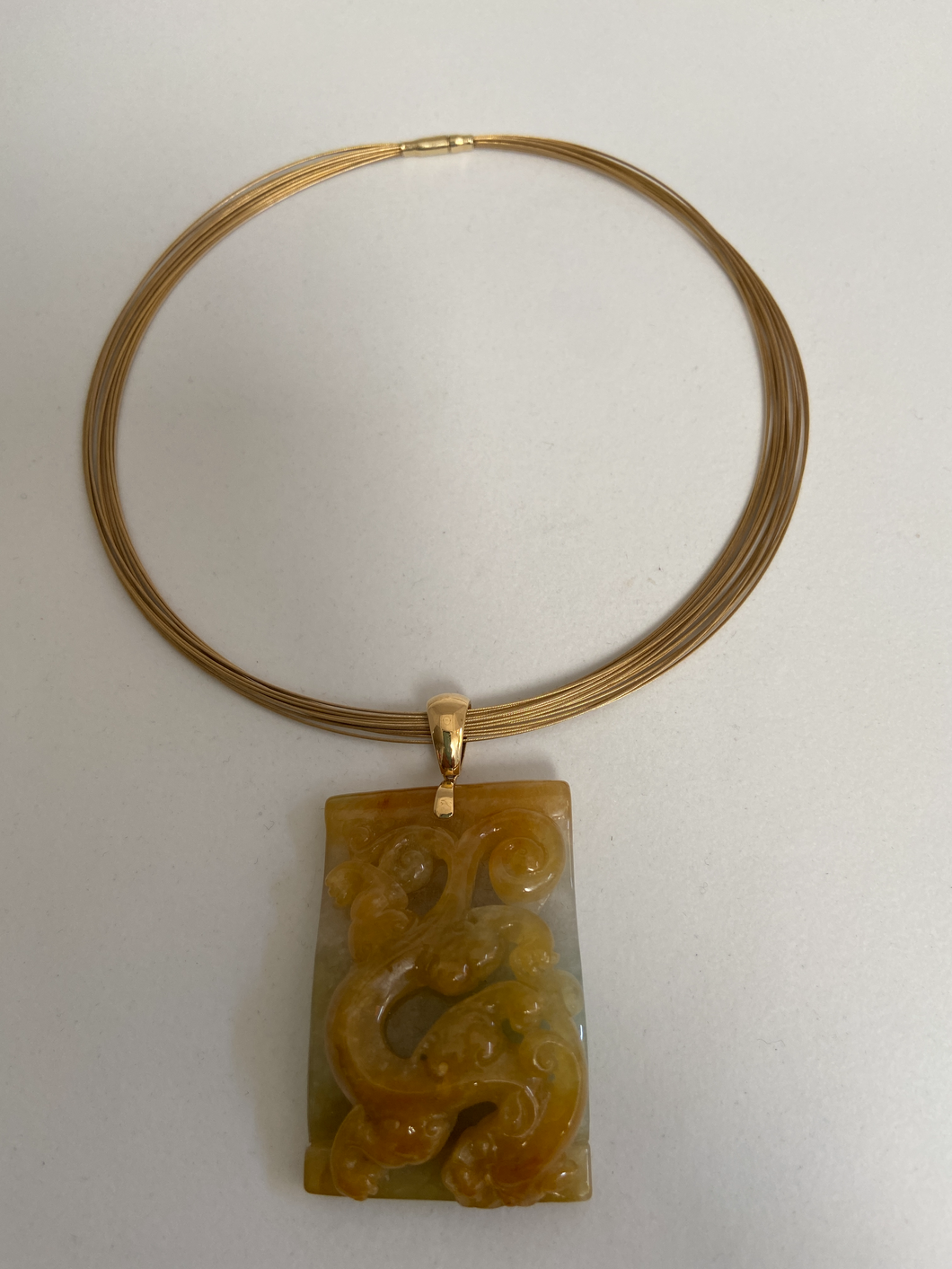 18K YELLOW JADE PENDANT WITH CARVED DRAGON